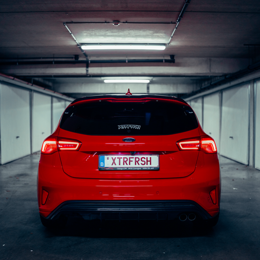 XTRFRSH OG drip sticker on a car window.