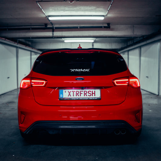 XTRFRSH grafitti sticker on a car window.