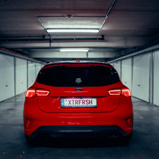 XTRFRSH Work/Stance sticker on a car window.