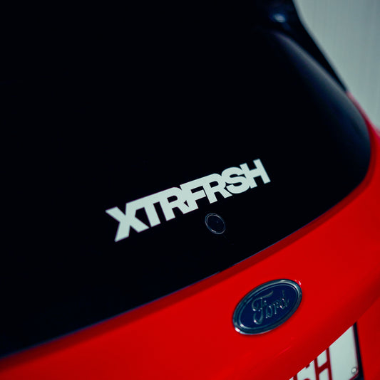 XTRFRSH bold sticker on a car window.