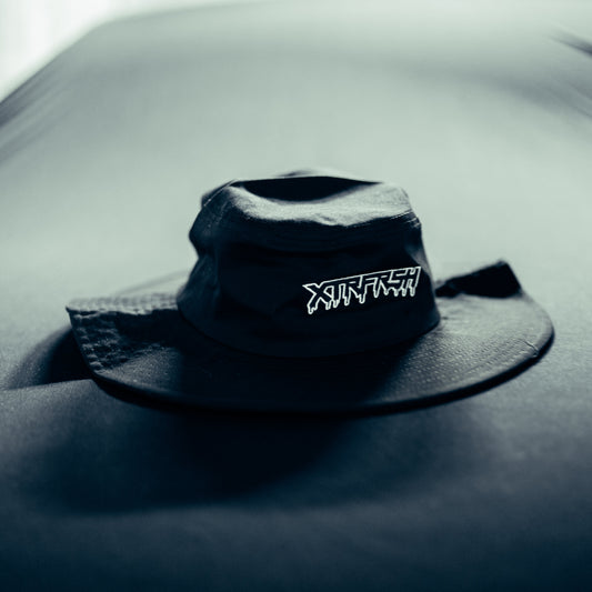 Black bucket hat with white XTRFRSH embroidery.