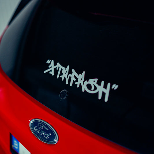 XTRFRSH grafitti sticker on a car window.