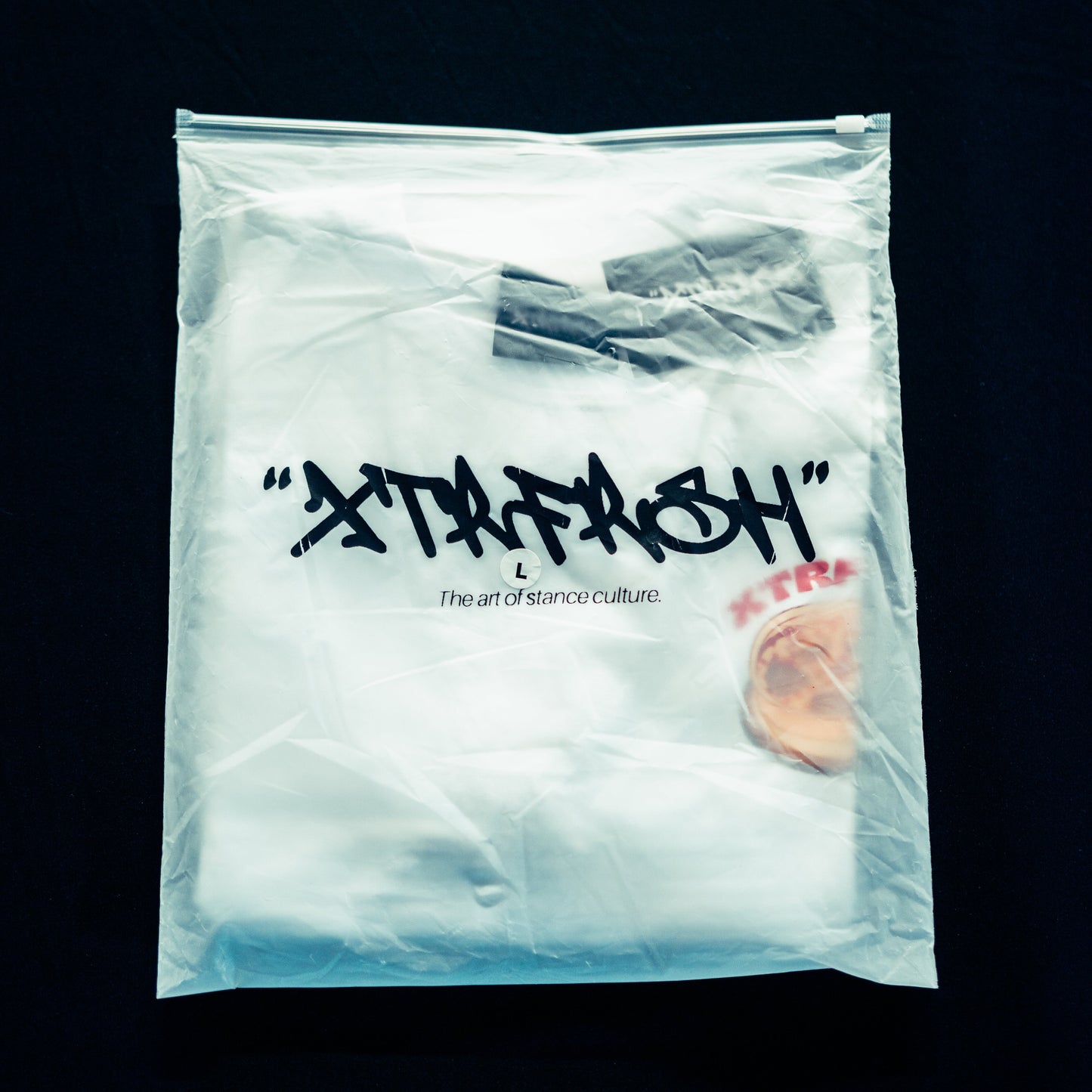 XTRFRSH bag with the Stance 'nd Slices t-shirt inside.