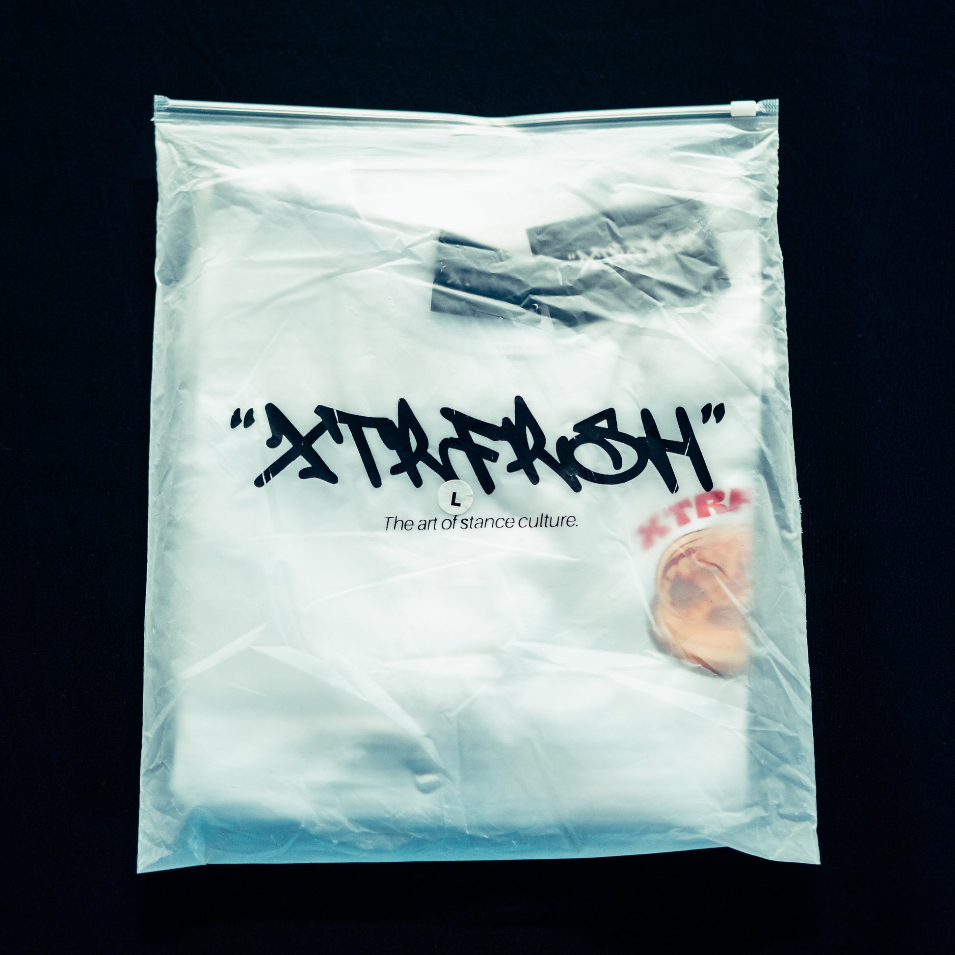 XTRFRSH bag with the Stance 'nd Slices t-shirt inside.