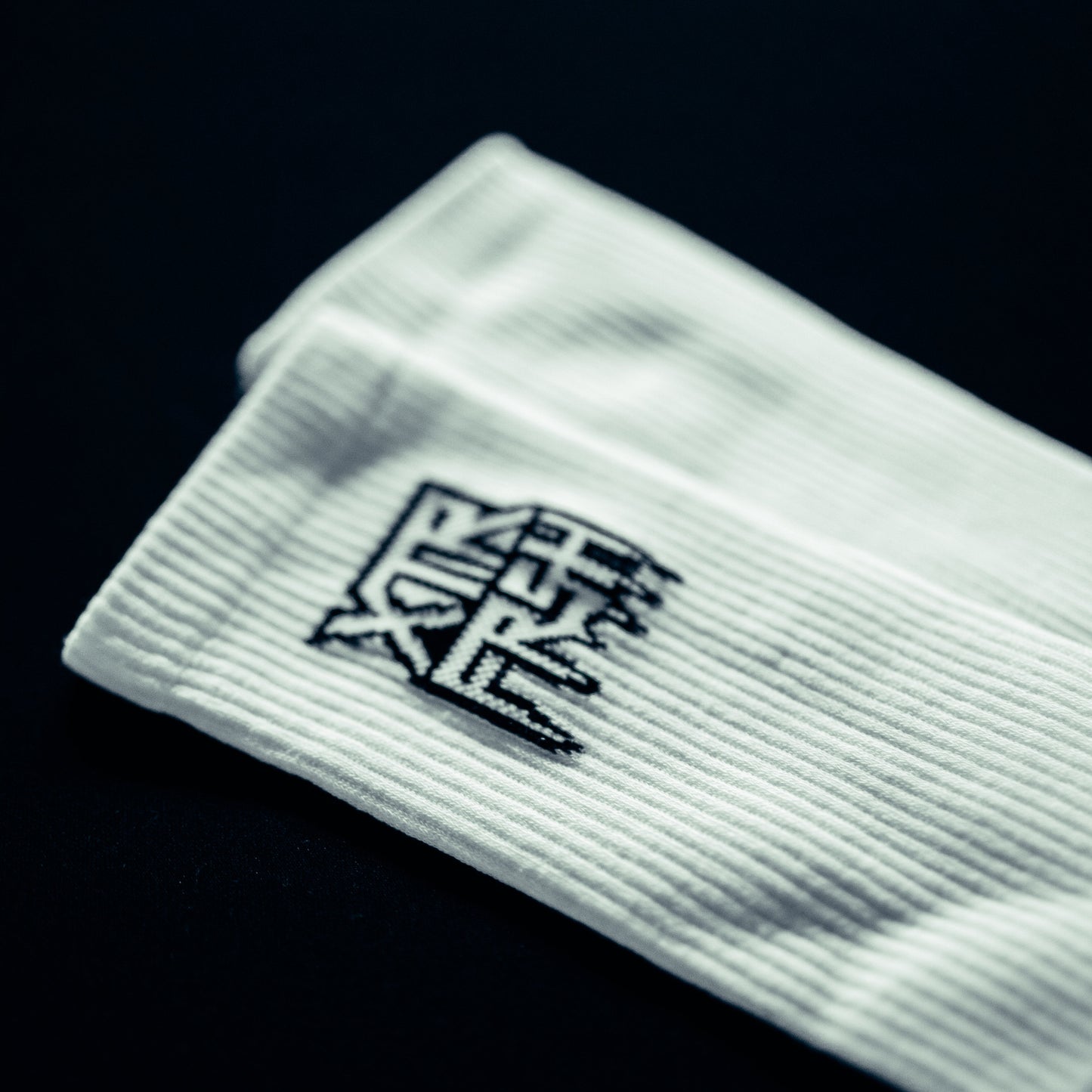 White socks with a black XTRFRSH logo.