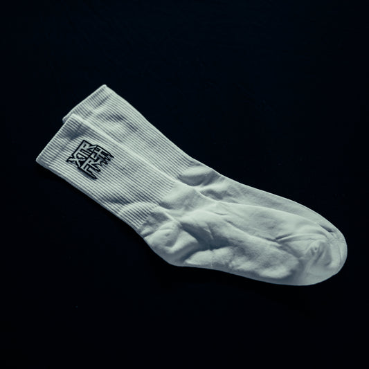 White socks with a black XTRFRSH logo.