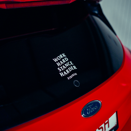 XTRFRSH Work/Stance sticker on a car window.